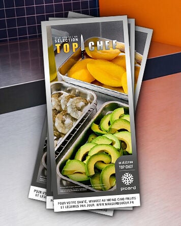 Prospectus Picard S&eacute;lection Top Chef pr&eacute;sentant des crevettes crues, des tranches de mangue et des avocats pr&eacute;par&eacute;s, mis en sc&egrave;ne comme en cuisine professionnelle.